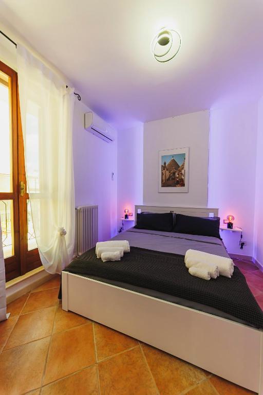 Postel nebo postele na pokoji v ubytování Don Ciccio Apartments&Suite