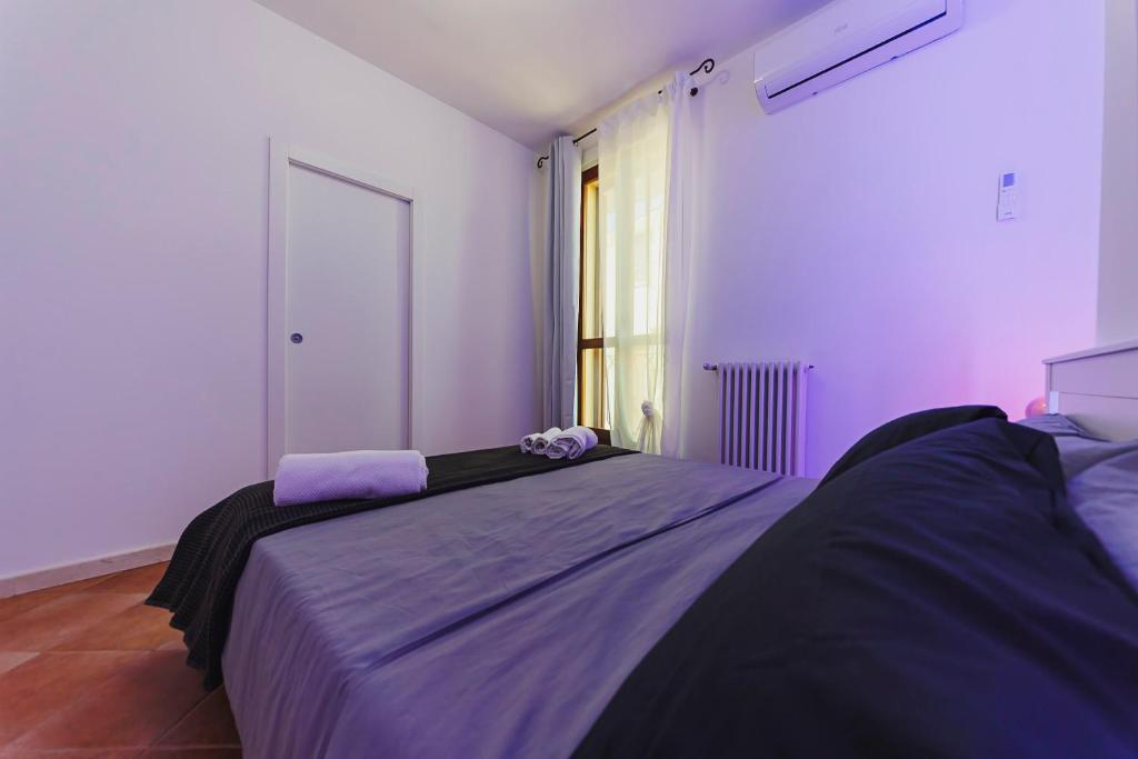 Postel nebo postele na pokoji v ubytování Don Ciccio Apartments&Suite