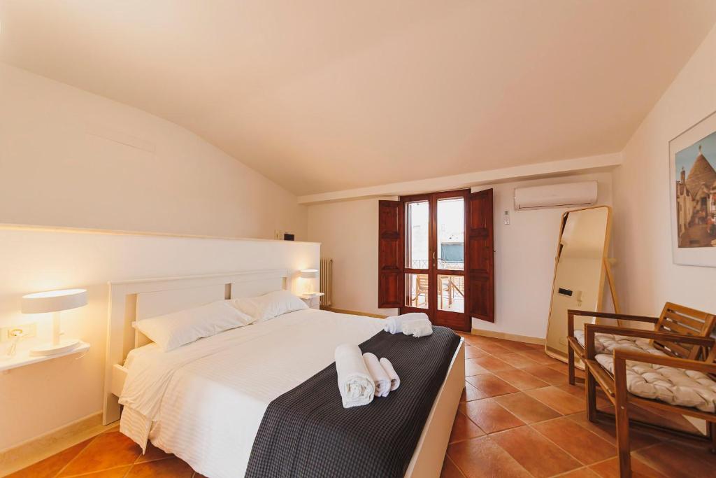 Postel nebo postele na pokoji v ubytování Don Ciccio Apartments&Suite