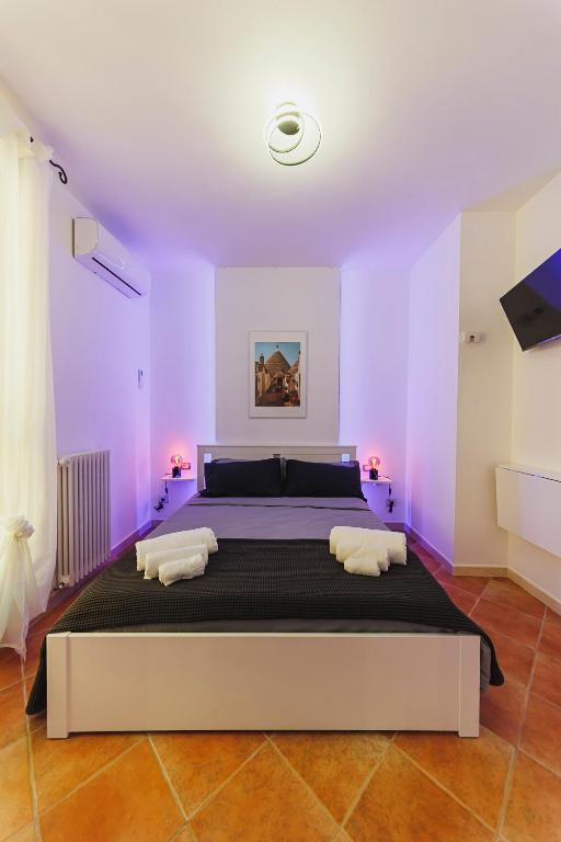 Postel nebo postele na pokoji v ubytování Don Ciccio Apartments&Suite