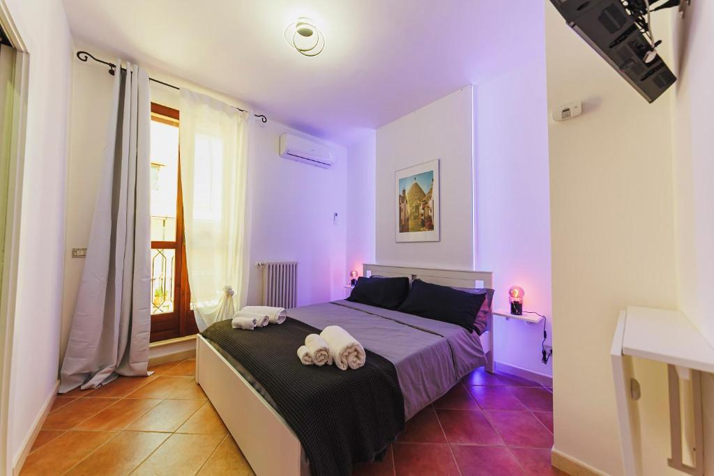 Postel nebo postele na pokoji v ubytování Don Ciccio Apartments&Suite