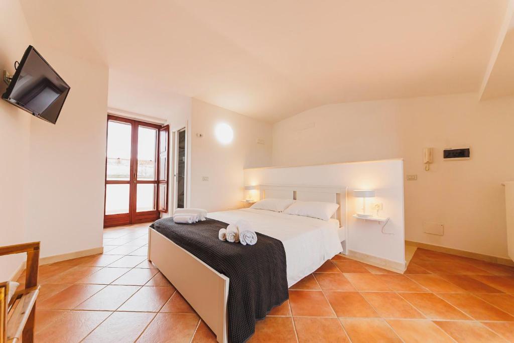 Postel nebo postele na pokoji v ubytování Don Ciccio Apartments&Suite