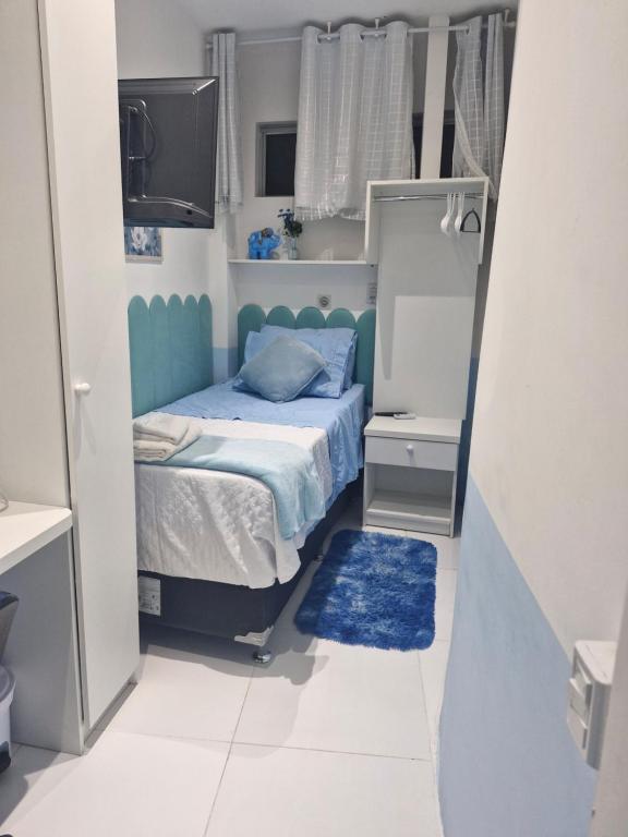 Ένα ή περισσότερα κρεβάτια σε δωμάτιο στο Quarto de solteiro para 1 pessoa