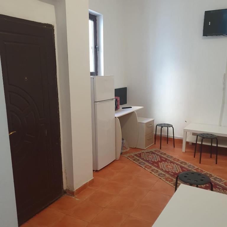 TV a/nebo společenská místnost v ubytování Cazare - Accommodation