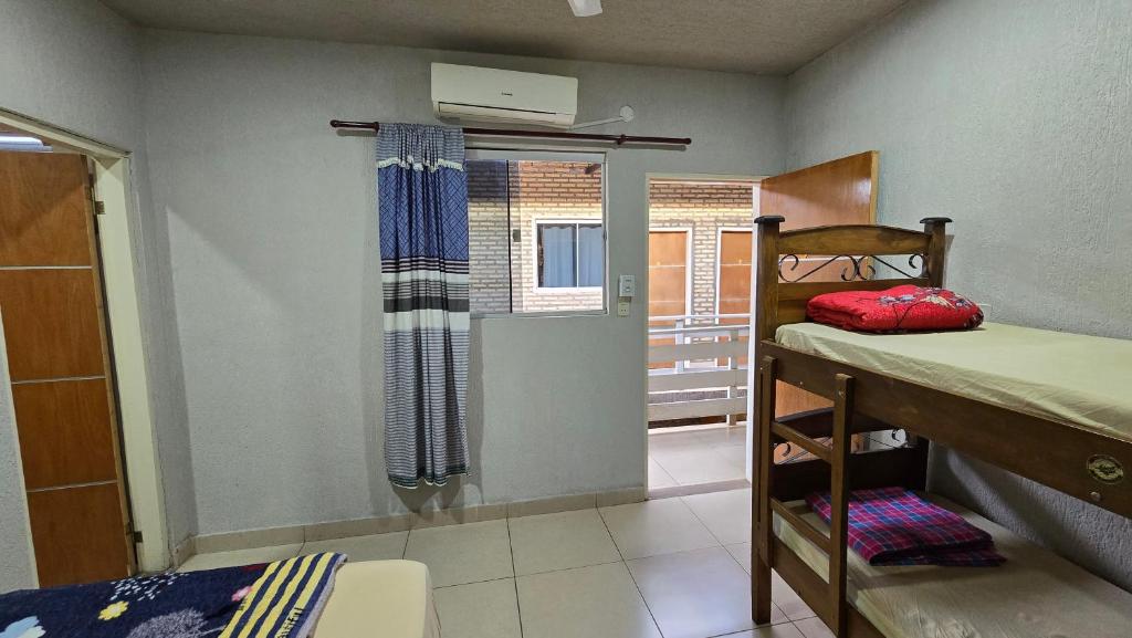 Postel nebo postele na pokoji v ubytování Hostal Fontana Di Luque