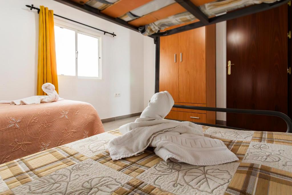 Postel nebo postele na pokoji v ubytování Molino de Lucero, casa rural