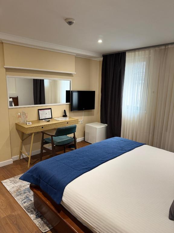 TV a/nebo společenská místnost v ubytování Hotel Astra