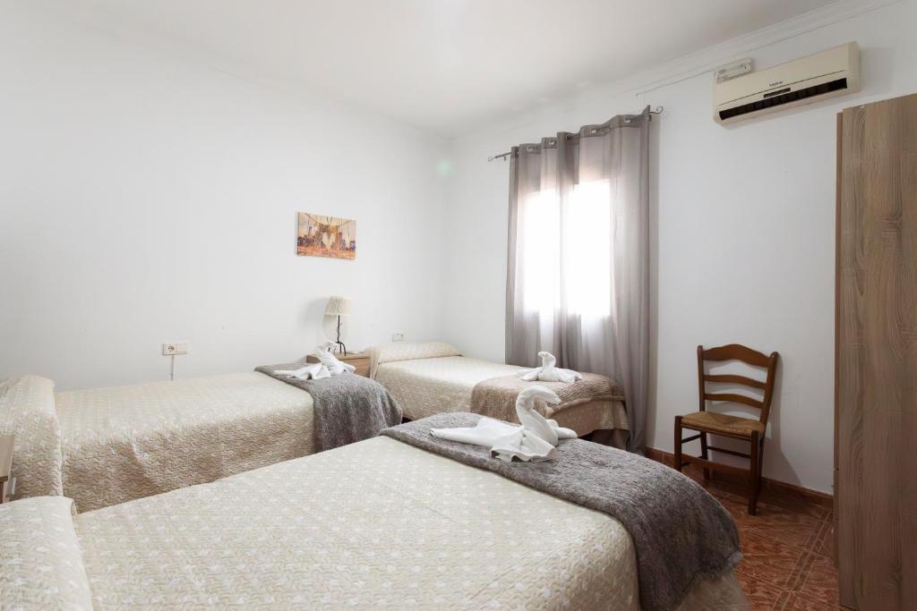 Postel nebo postele na pokoji v ubytování Molino de Lucero, casa rural