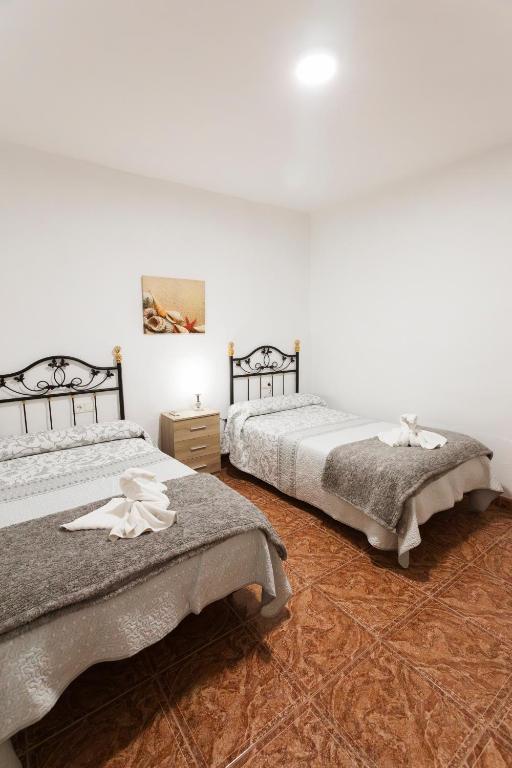 Postel nebo postele na pokoji v ubytování Molino de Lucero, casa rural