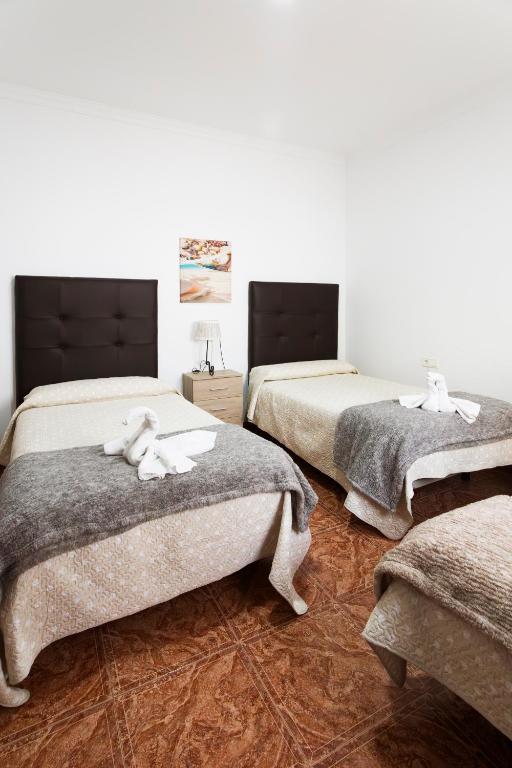 Postel nebo postele na pokoji v ubytování Molino de Lucero, casa rural