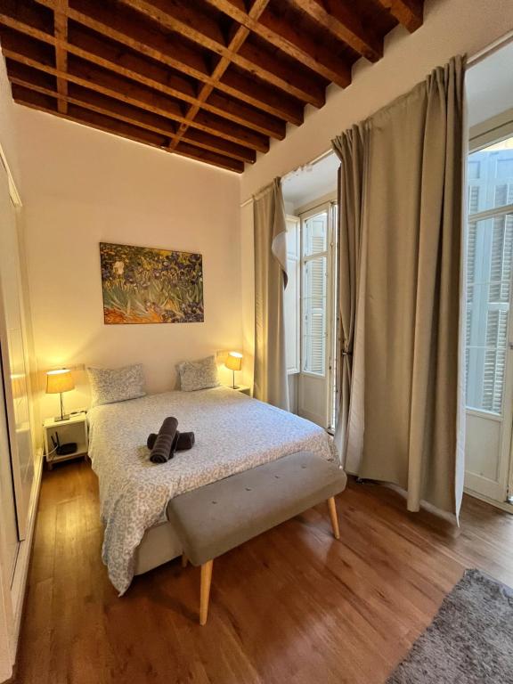 Posteľ alebo postele v izbe v ubytovaní Larios Deluxe Studio