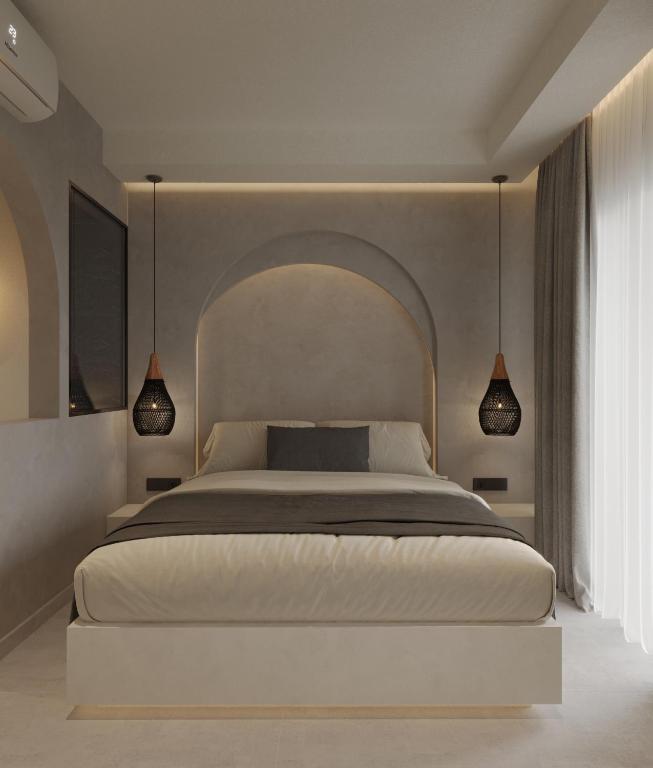 Postel nebo postele na pokoji v ubytování néreya luxury rooms