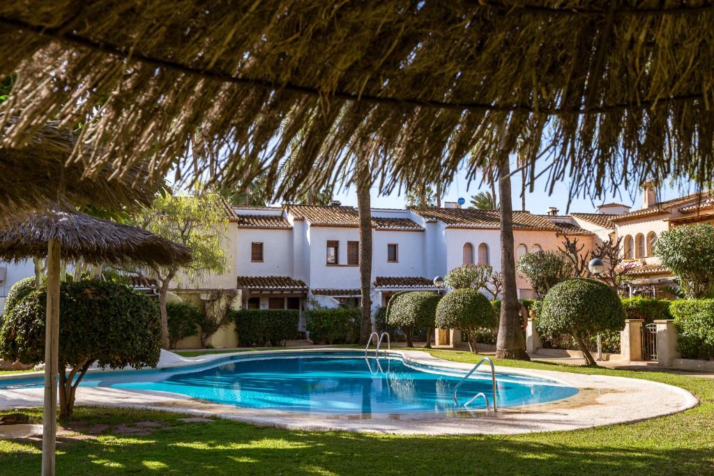 a swimming pool in front of a villa at K-PALM by Nuka Homes in Jávea