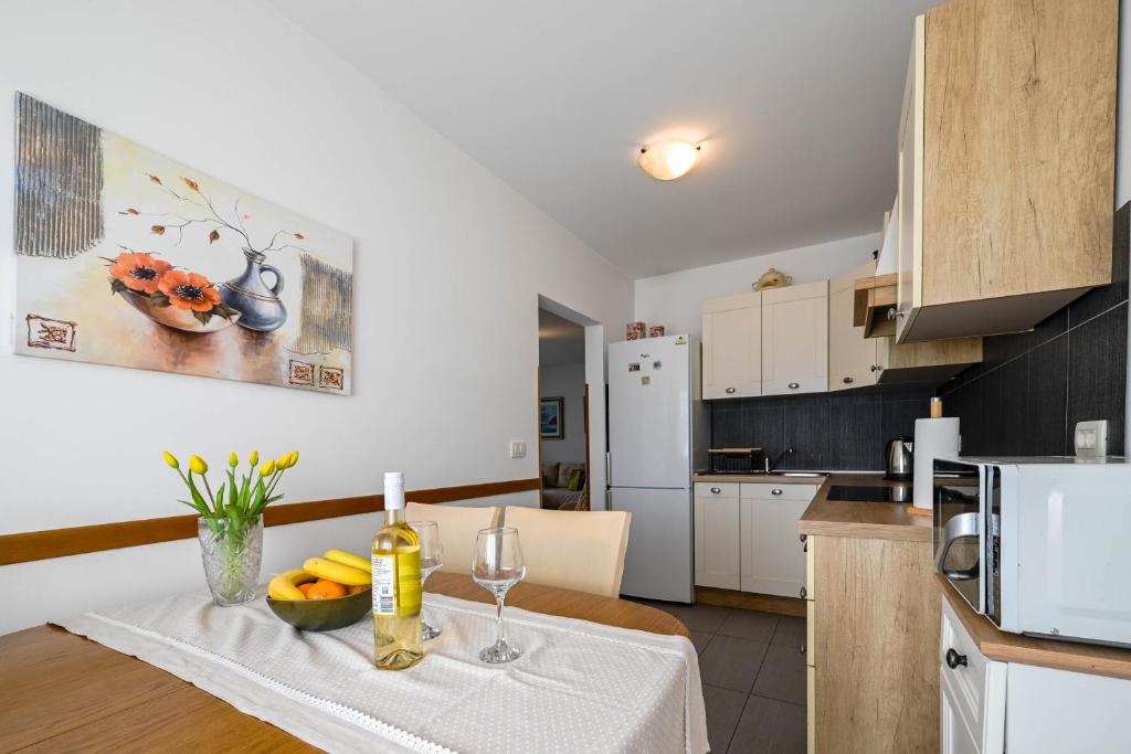 Kuchyň nebo kuchyňský kout v ubytování Apartment Emma