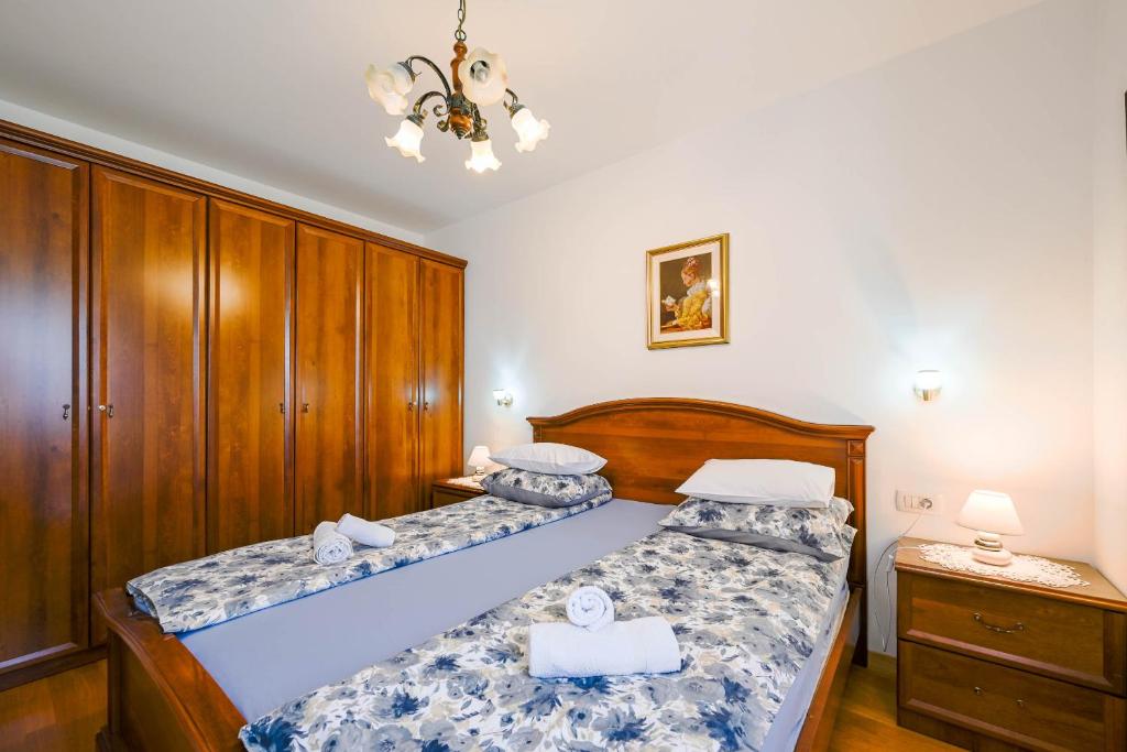 Postel nebo postele na pokoji v ubytování Apartment Emma