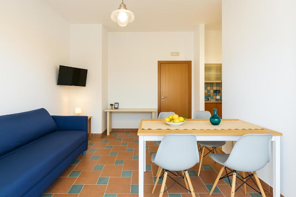 TV a/nebo společenská místnost v ubytování Le Grand Bleu - Gioia Apartments