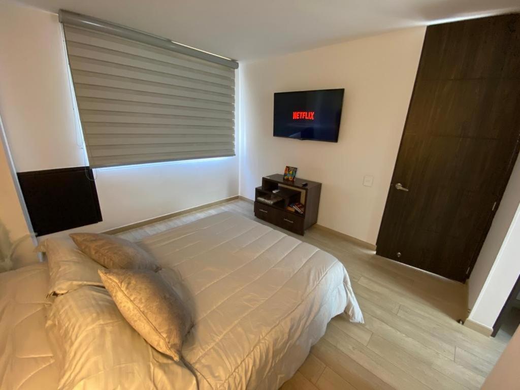Postel nebo postele na pokoji v ubytování Elegante y comfortable Apartasuite!