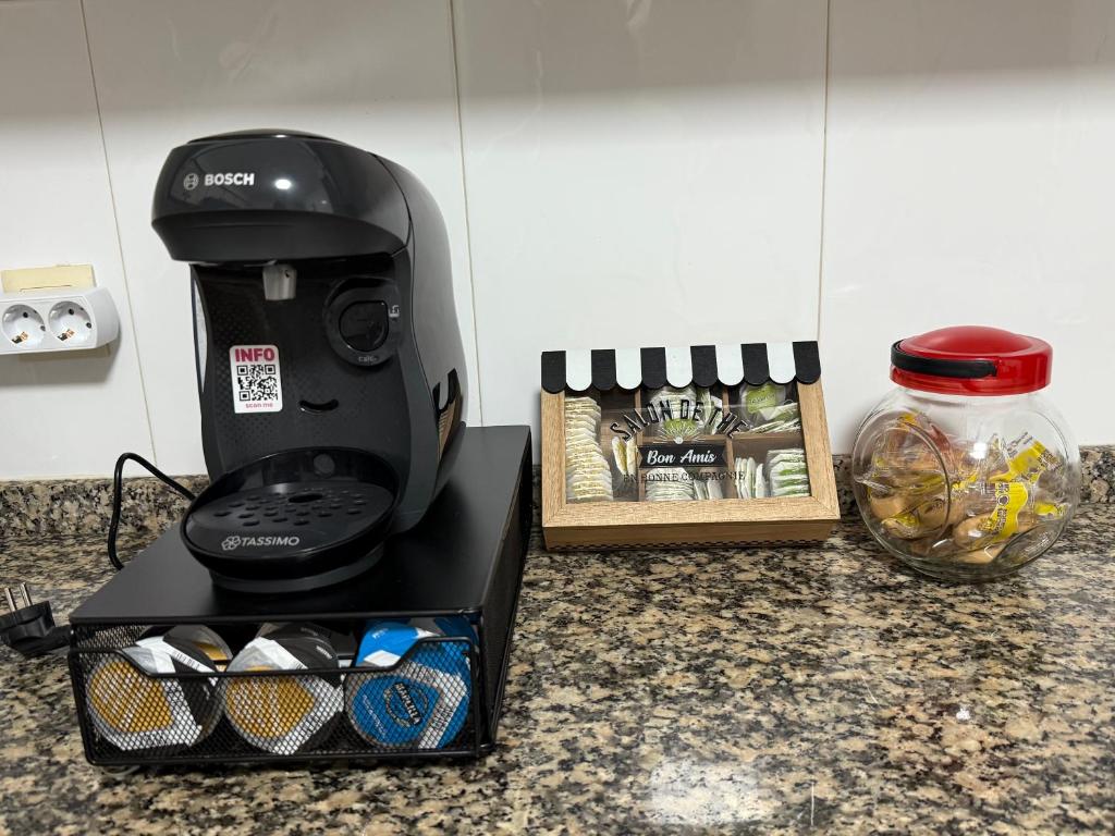 Coffee and tea making facilities at Piso Vacaciones en el mar