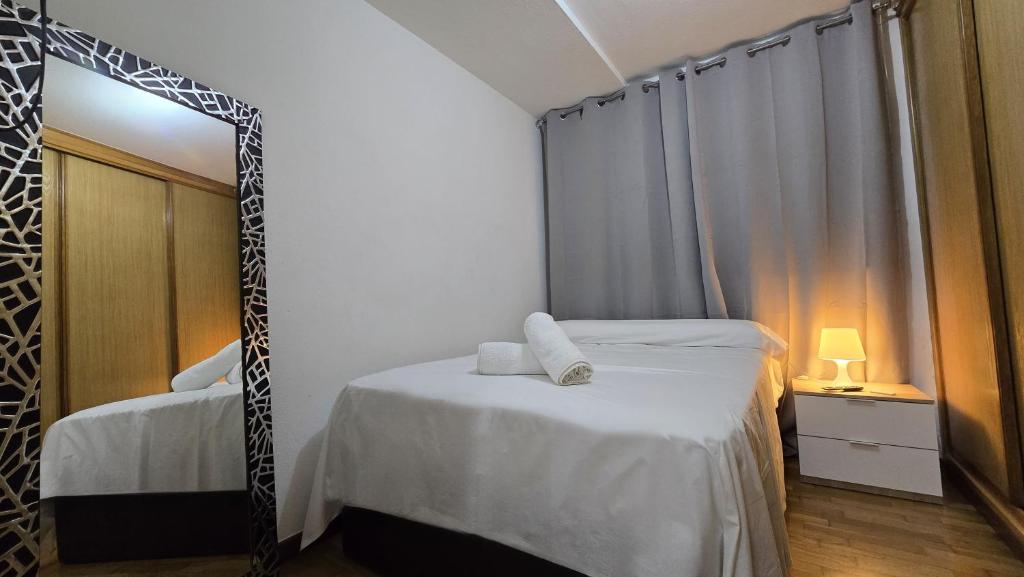 Ένα ή περισσότερα κρεβάτια σε δωμάτιο στο Apartamento Verín-Chaves con parking