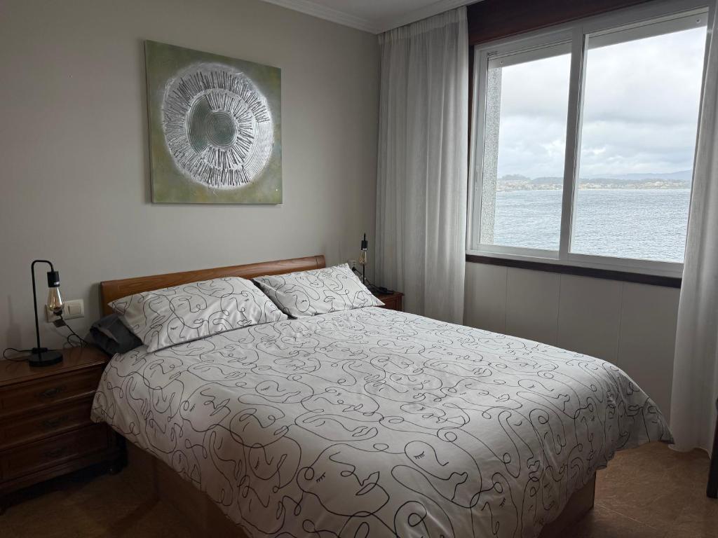 A bed or beds in a room at Piso Vacaciones en el mar