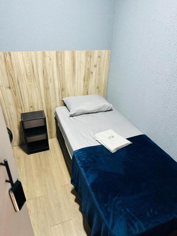 Postel nebo postele na pokoji v ubytování ON HOSTEL II Gru Aeroporto Translado 24 hs