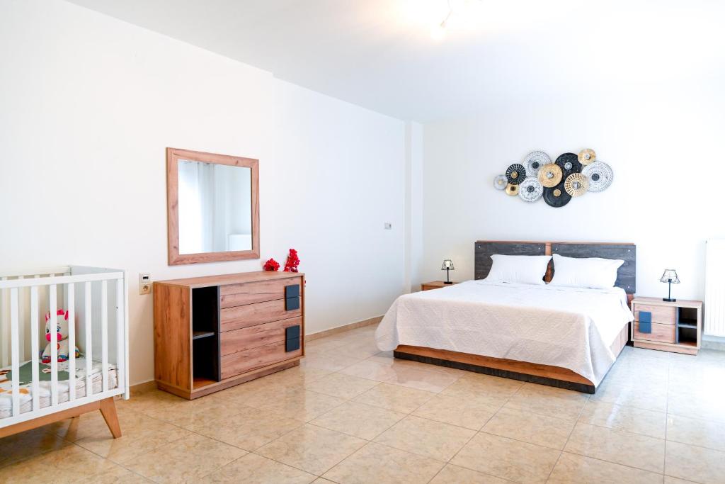 Posteľ alebo postele v izbe v ubytovaní Dafni's house