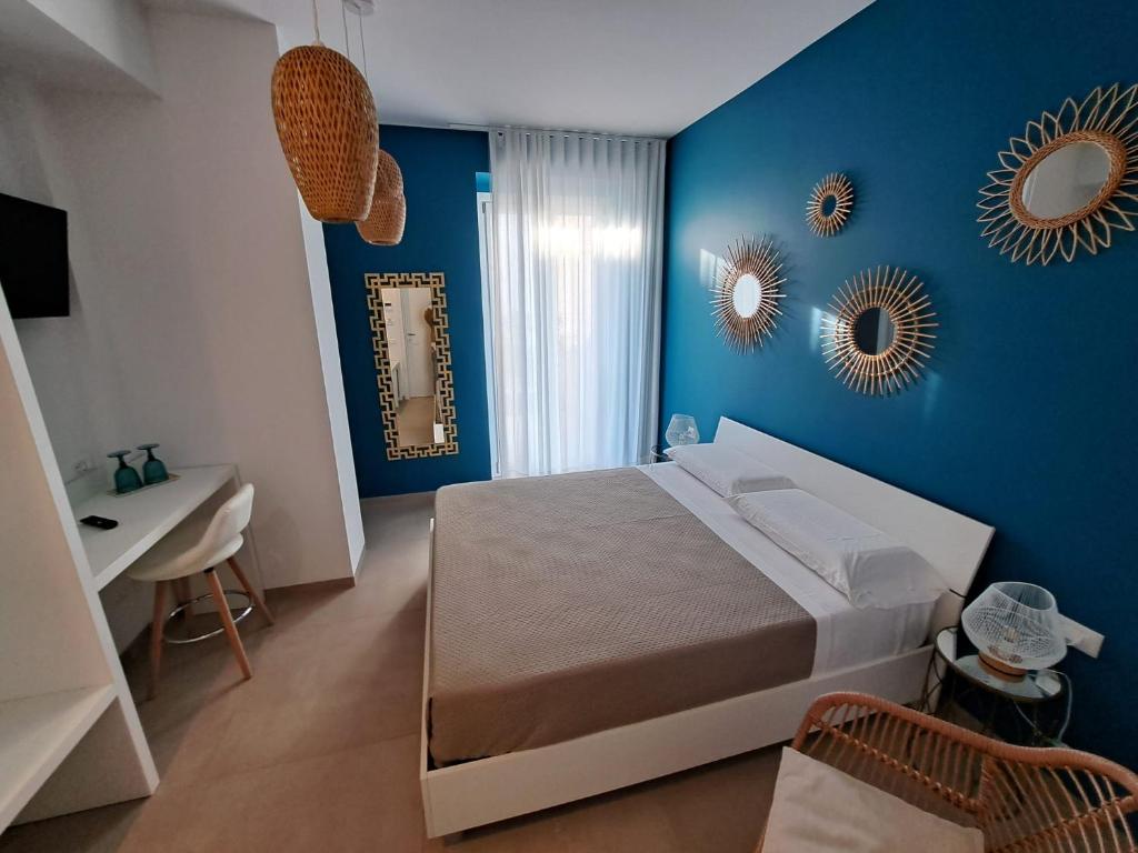 Postel nebo postele na pokoji v ubytování Le Dune Luxury Rooms