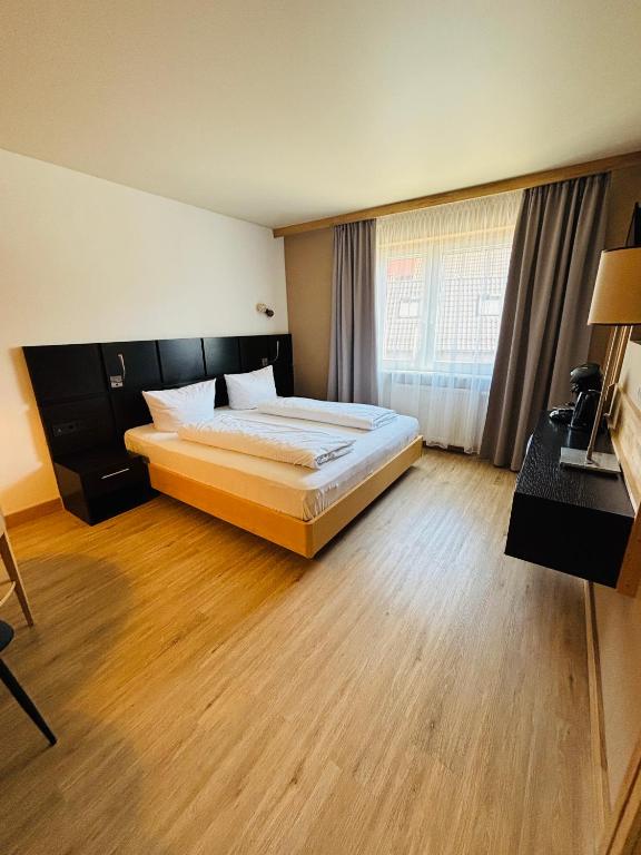 Postel nebo postele na pokoji v ubytování L-DOM