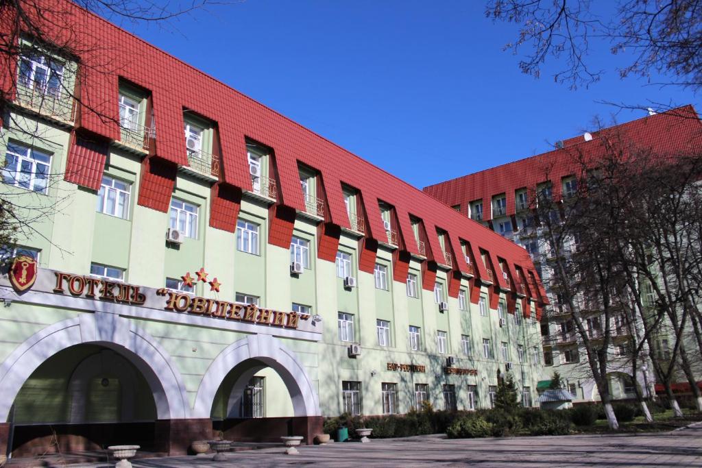 a building with a sign on the side of it at Yubileinaia in Sumy