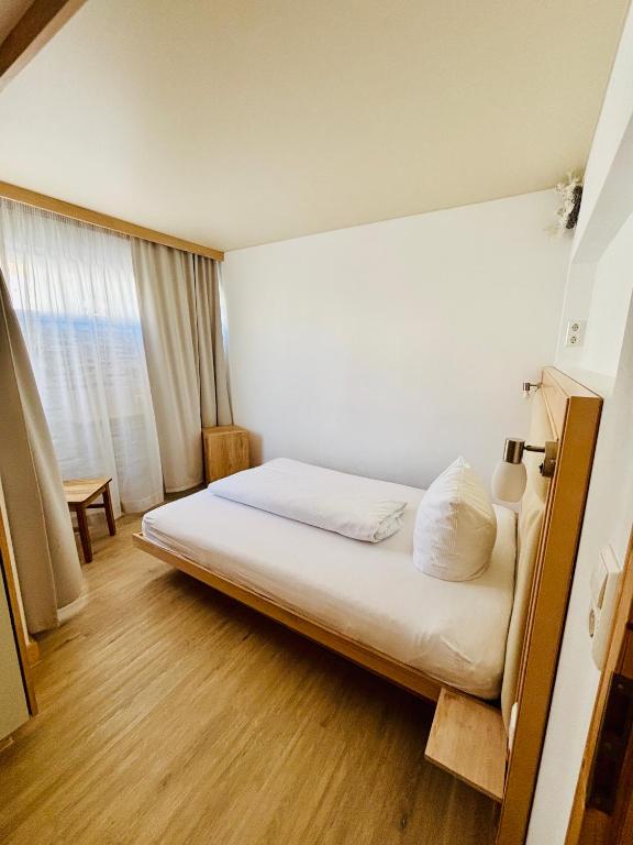 Postel nebo postele na pokoji v ubytování L-DOM