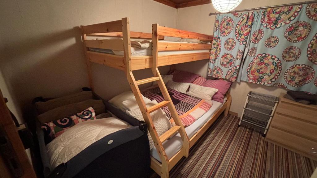 Postel nebo postele na pokoji v ubytování Chata, Máchovo jezero