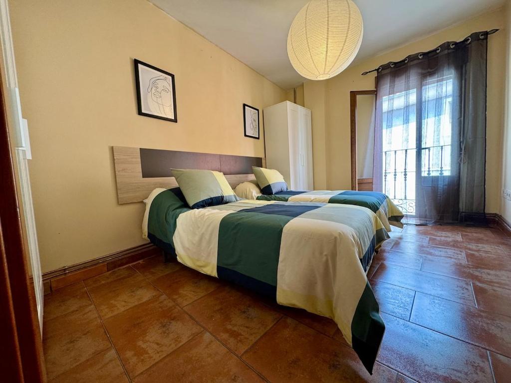 Postel nebo postele na pokoji v ubytování Casa acogedora en el centro histórico de Cuéllar