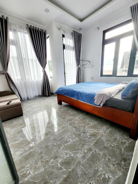 Postel nebo postele na pokoji v ubytování Happy Bun Hotel Da Lat