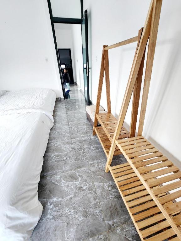Postel nebo postele na pokoji v ubytování Happy Bun Hotel Da Lat