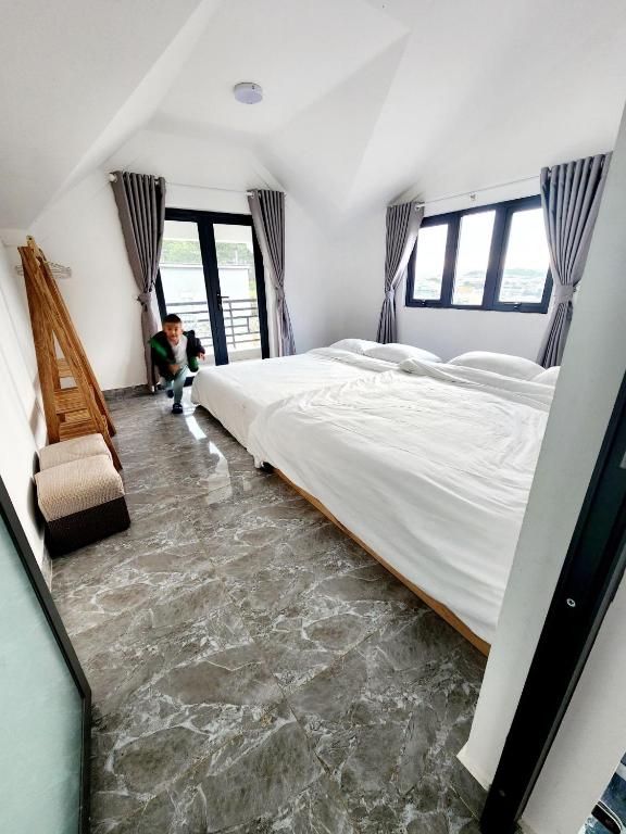 Postel nebo postele na pokoji v ubytování Happy Bun Hotel Da Lat