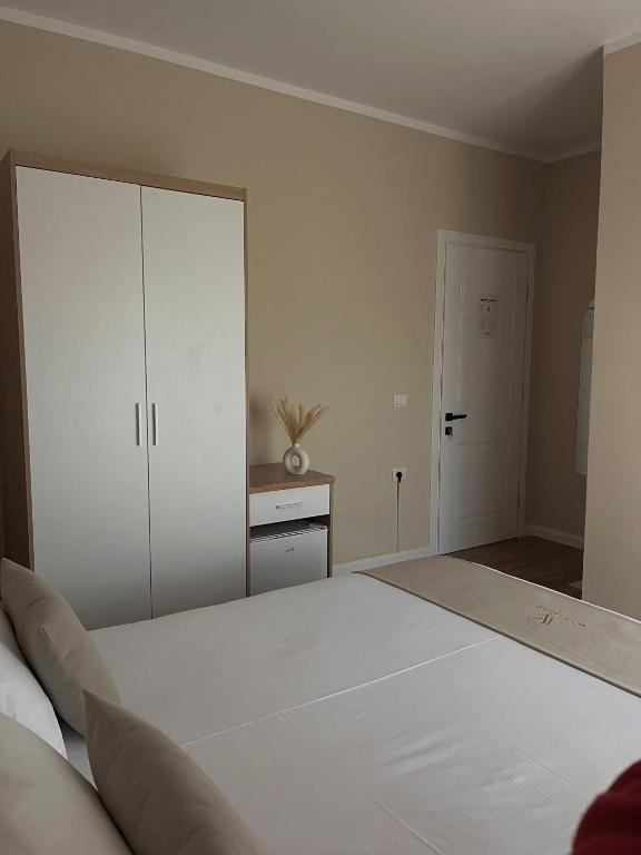 Postel nebo postele na pokoji v ubytování Villa Tabaku