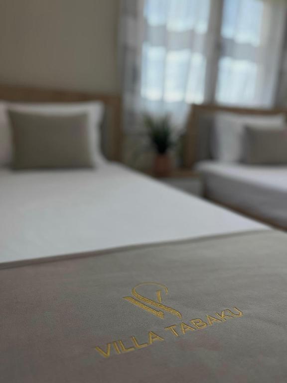 Postel nebo postele na pokoji v ubytování Villa Tabaku