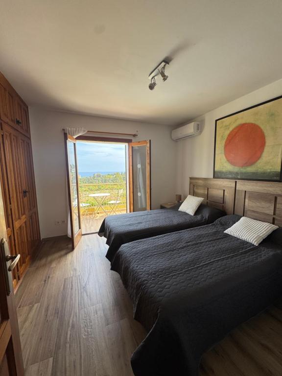 Katil atau katil-katil dalam bilik di Cozy Duplex Les Rotes