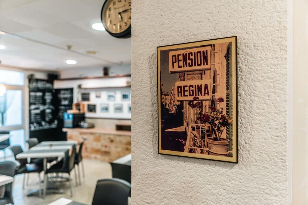 a picture of a restaurant with a sign on a wall at Hostal Regina in Blanes