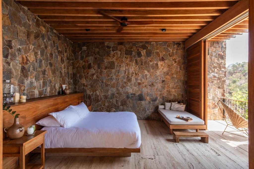 Postel nebo postele na pokoji v ubytování La Valise Mazunte
