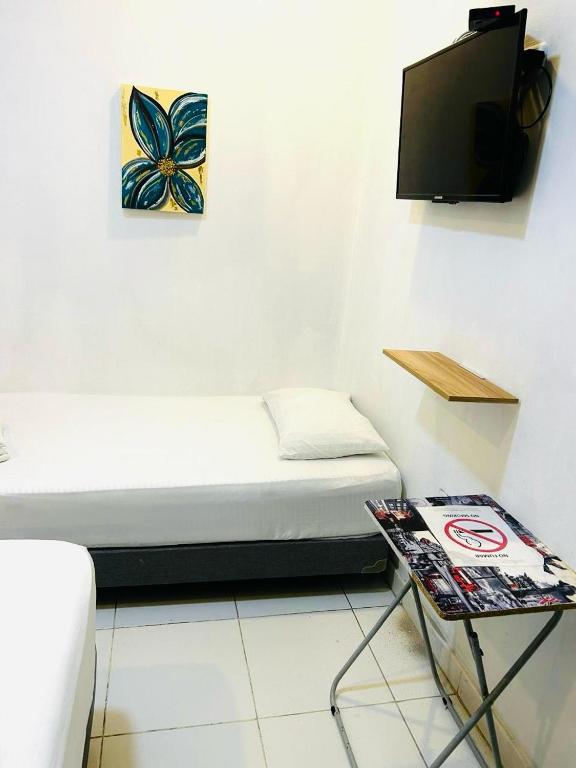 TV a/nebo společenská místnost v ubytování Riviera Central Hotel - Monteria