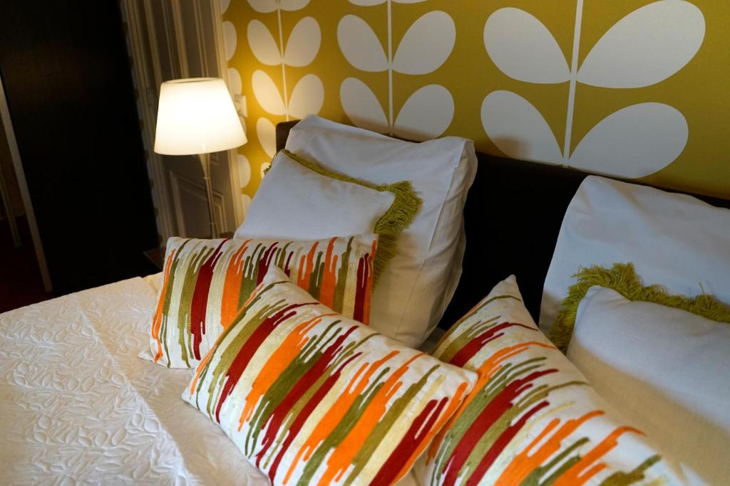 Postel nebo postele na pokoji v ubytování City Hotel Koningsvlinder