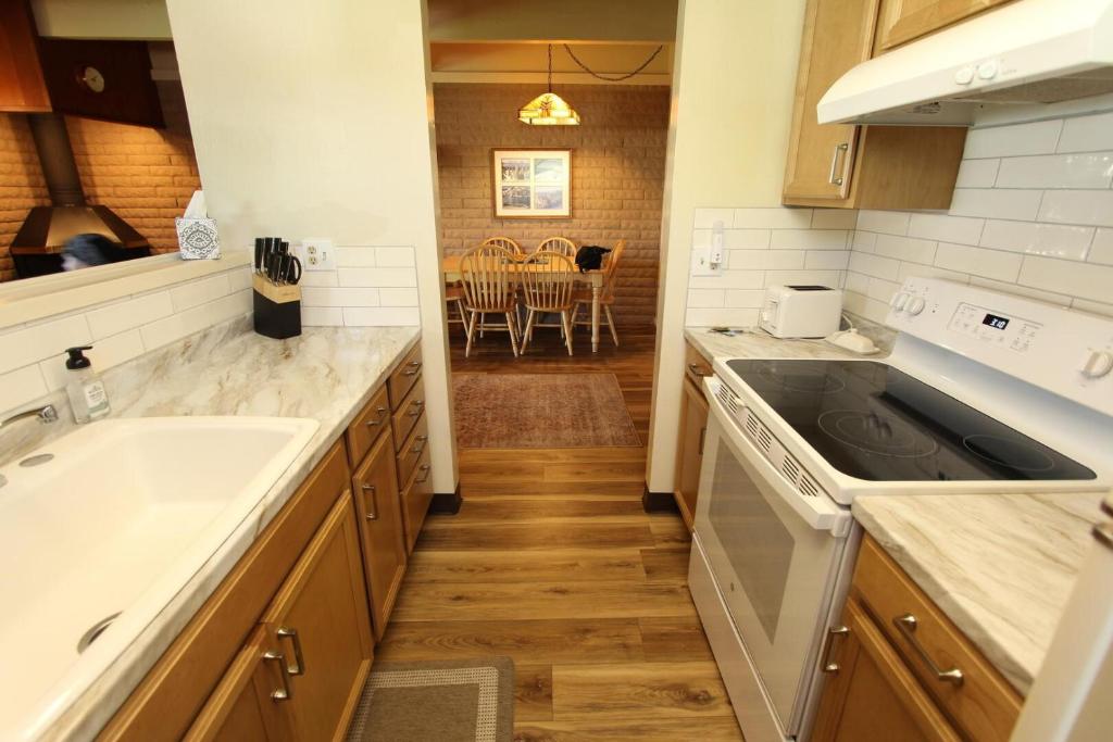 a kitchen with a sink and a stove top oven at TKC0604 - Betty Ann's Place condo in South Lake Tahoe