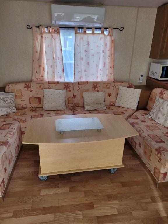 Posezení v ubytování Charmant mobil-home à 200 m des plages