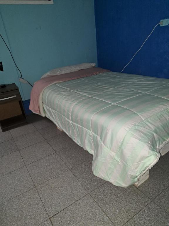 Postel nebo postele na pokoji v ubytování Hostal San Rafael Patagonia
