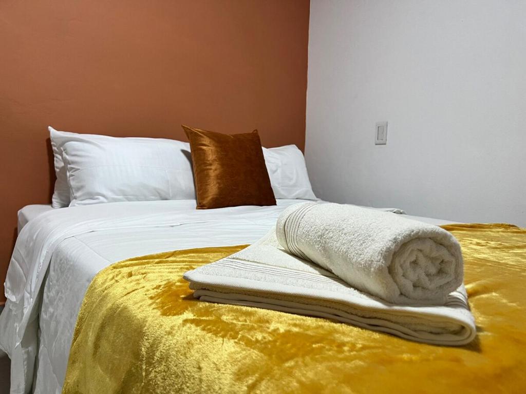 Letto o letti in una camera di Apto Carmelina - a solo dos cuadras del parque