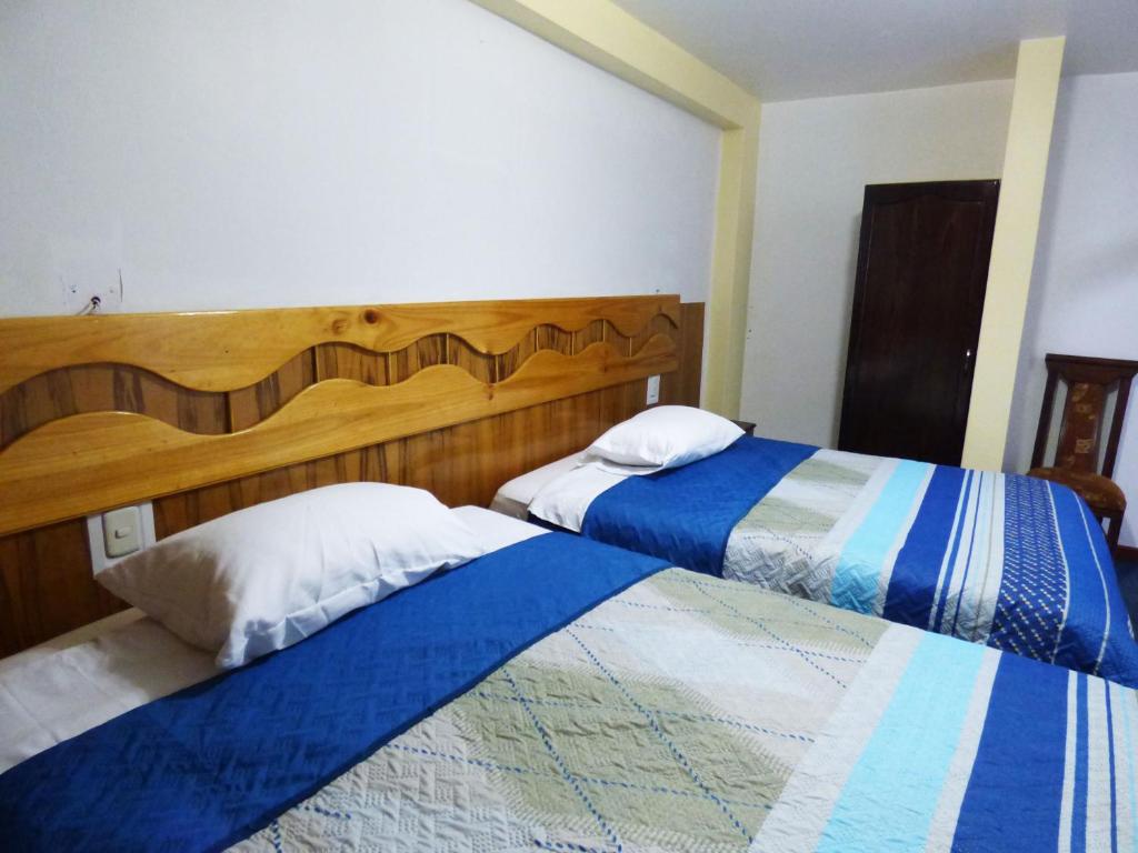 Postel nebo postele na pokoji v ubytování Nak Hoteles Plaza