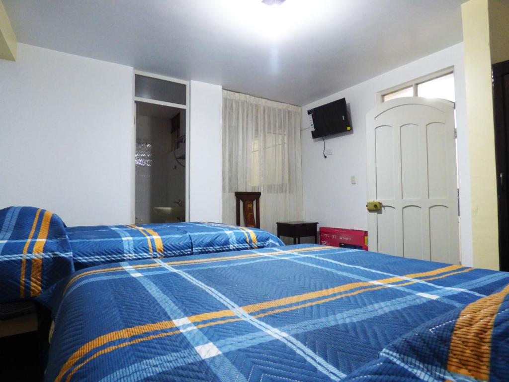Postel nebo postele na pokoji v ubytování Nak Hoteles Plaza