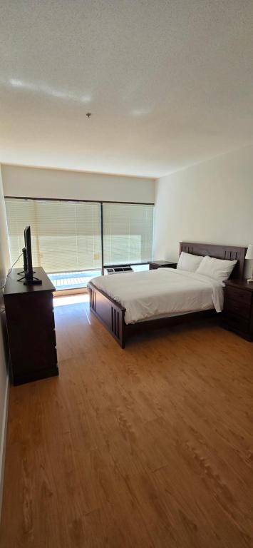 Postel nebo postele na pokoji v ubytování New Royal Inn