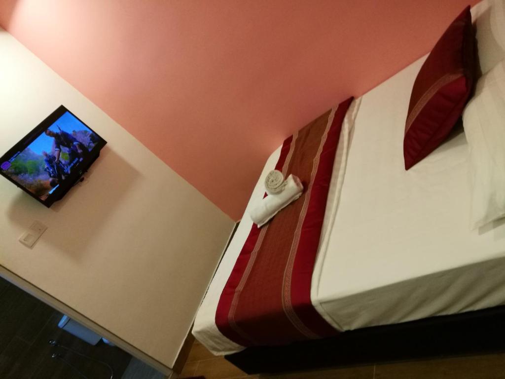 Postel nebo postele na pokoji v ubytování D'Spark Hotel Bayu